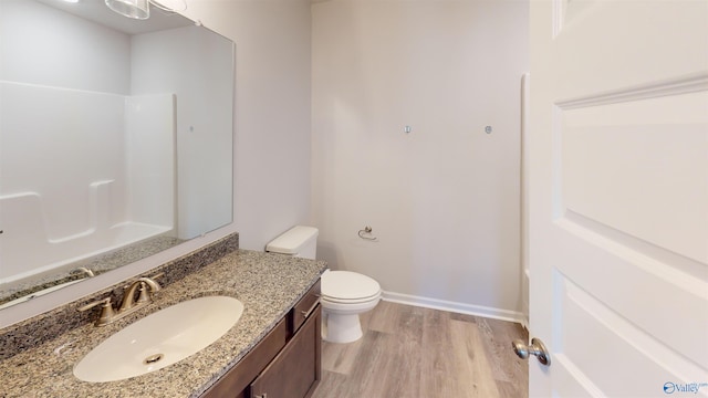 209 Roman Randall Rd, New Market, AL 35761 - full bathroom featuring toilet, vanity, wood finished floors, and walk in shower