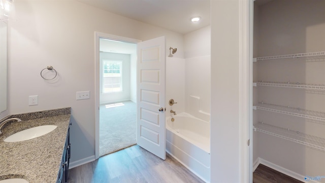 209 Roman Randall Rd, New Market, AL 35761 - bathroom with vanity,  shower combination, baseboards, and wood finished floors