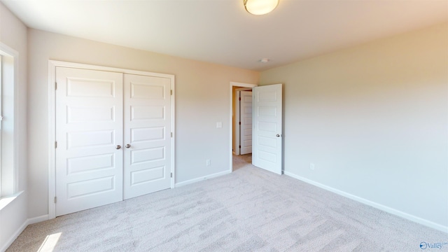 209 Roman Randall Rd, New Market, AL 35761 - unfurnished bedroom with a closet, baseboards, and carpet flooring