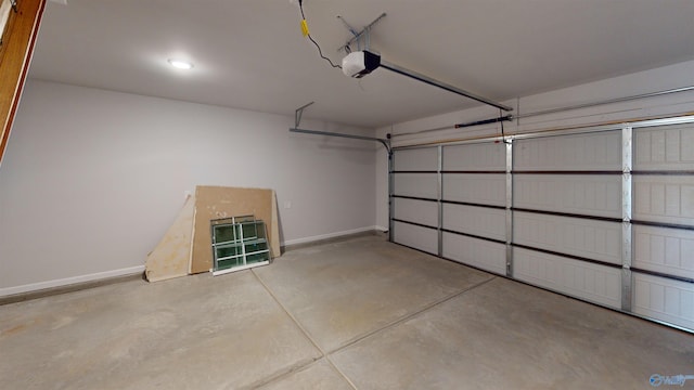 209 Roman Randall Rd, New Market, AL 35761 - garage featuring baseboards and a garage door opener