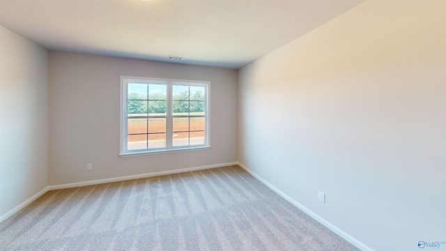 209 Roman Randall Rd, New Market, AL 35761 - empty room with light carpet, visible vents, and baseboards