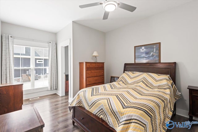 bedroom with ceiling fan and hardwood / wood-style flooring