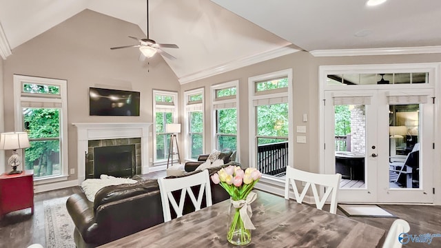 10 Verdant Cir SE, Huntsville, AL 35803 - dining area with wood finished floors, ceiling fan, lofted ceiling, a tile fireplace, and french doors