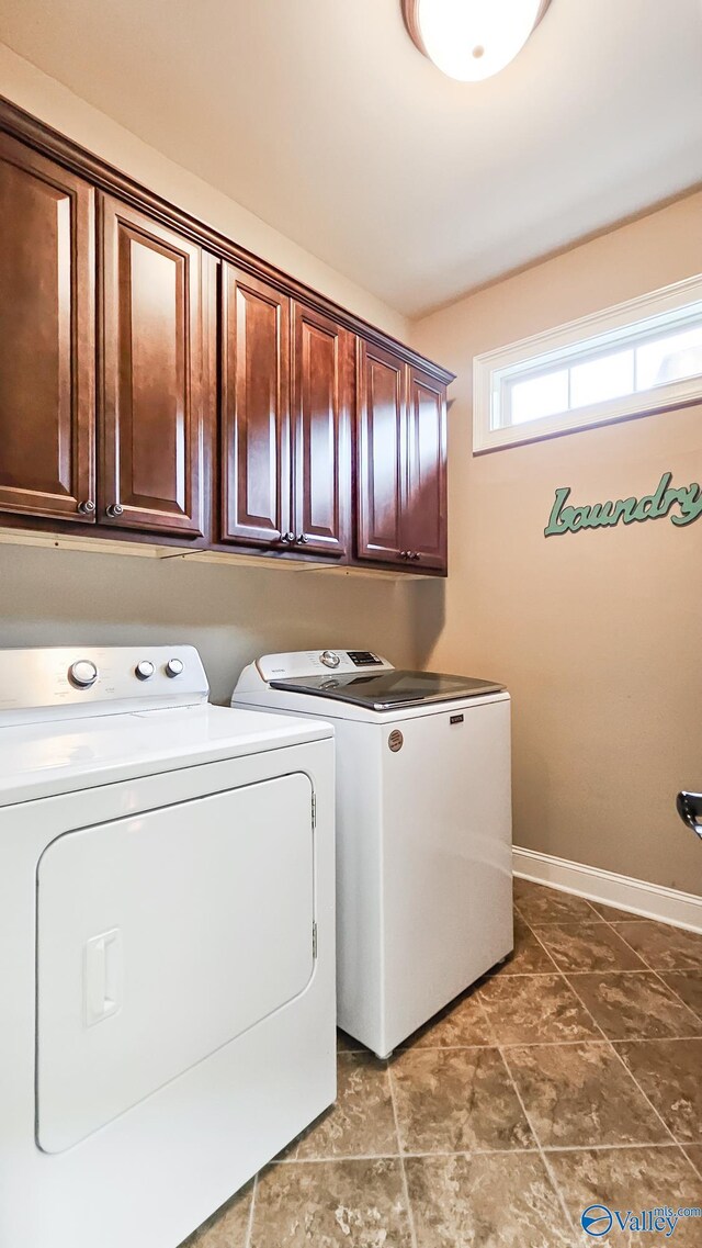 10 Verdant Cir SE, Huntsville, AL 35803 - laundry room featuring cabinet space, separate washer and dryer, and baseboards