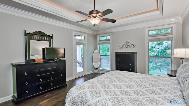 10 Verdant Cir SE, Huntsville, AL 35803 - bedroom with crown molding, a tray ceiling, access to exterior, dark wood finished floors, and multiple windows