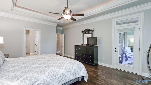 10 Verdant Cir SE, Huntsville, AL 35803 - bedroom featuring a tray ceiling, ornamental molding, dark wood-type flooring, access to exterior, and baseboards
