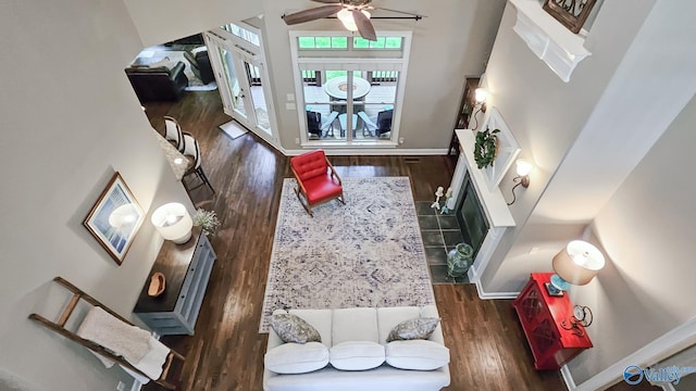 10 Verdant Cir SE, Huntsville, AL 35803 - living area featuring wood finished floors, a ceiling fan, baseboards, and a high ceiling