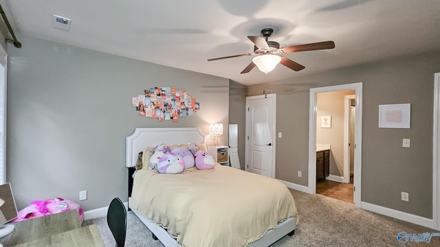 10 Verdant Cir SE, Huntsville, AL 35803 - bedroom with carpet floors, baseboards, ensuite bath, and ceiling fan