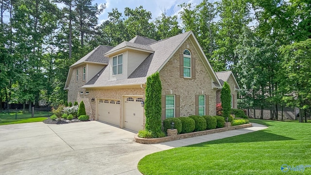 10 Verdant Cir SE, Huntsville, AL 35803 - view of front of property with concrete driveway, brick siding, an attached garage, and a shingled roof