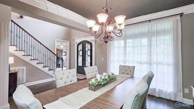 10 Verdant Cir SE, Huntsville, AL 35803 - dining room featuring a chandelier, wood finished floors, stairs, and baseboards