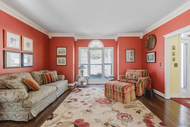 living room featuring crown molding, wood finished floors, and baseboards