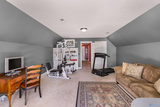 carpeted home office featuring visible vents, baseboards, a textured ceiling, and vaulted ceiling