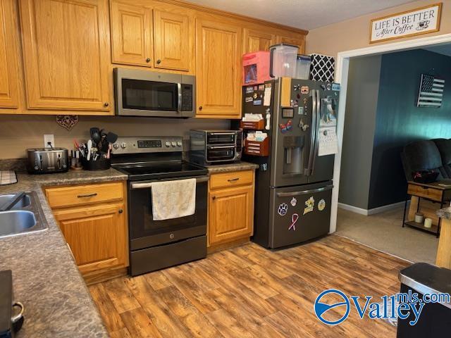 117 Simmons Cir, Fayetteville, TN 37334 - kitchen with appliances with stainless steel finishes and light wood finished floors