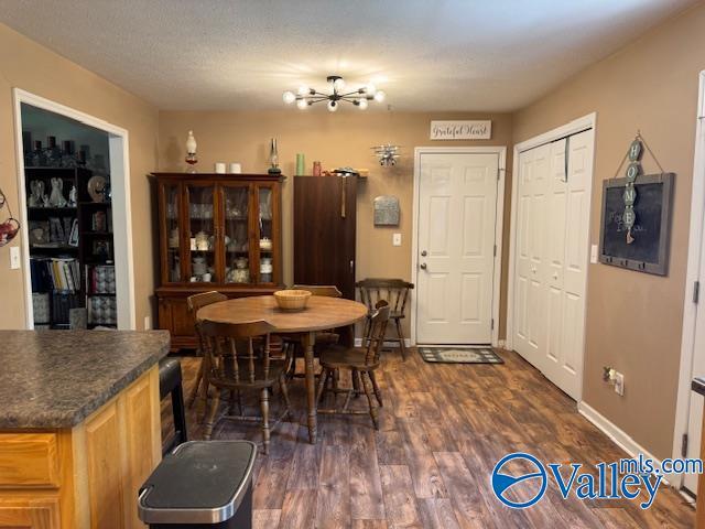 117 Simmons Cir, Fayetteville, TN 37334 - dining space with dark wood-style floors, a chandelier, and baseboards