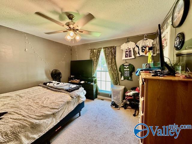 117 Simmons Cir, Fayetteville, TN 37334 - carpeted bedroom featuring a textured ceiling and a ceiling fan