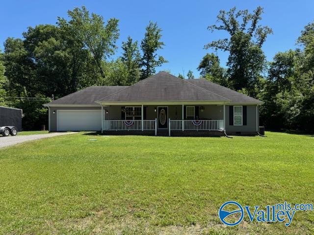 117 Simmons Cir, Fayetteville, TN 37334 - view of front of house with a porch, driveway, an attached garage, and a front yard