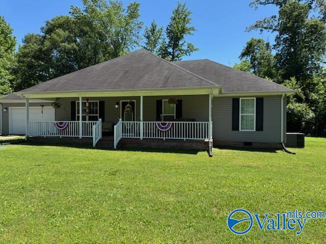 117 Simmons Cir, Fayetteville, TN 37334 - single story home with a porch, a garage, a front lawn, central air condition unit, and roof with shingles
