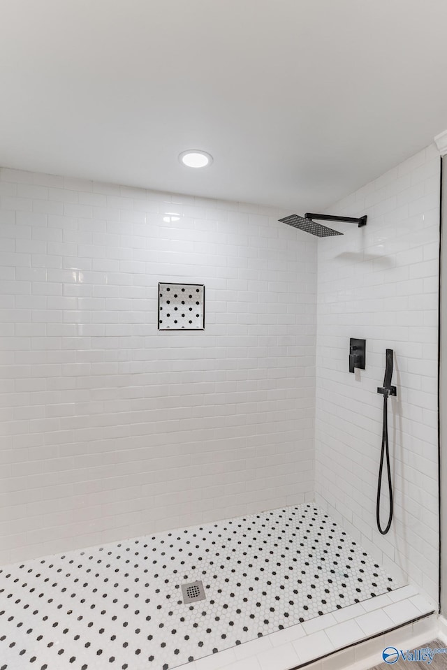 full bath featuring a shower stall