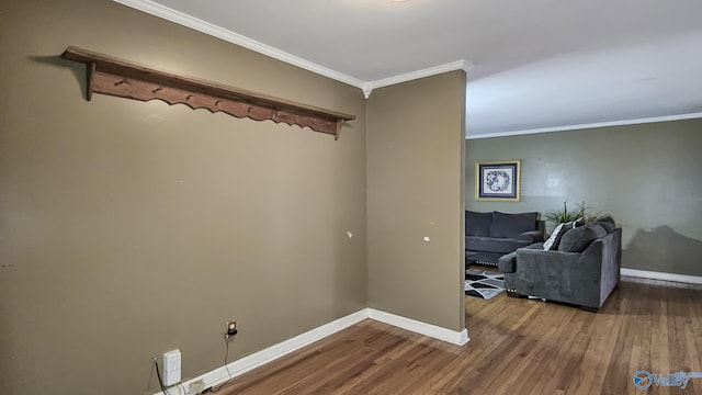 interior space featuring crown molding and hardwood / wood-style flooring