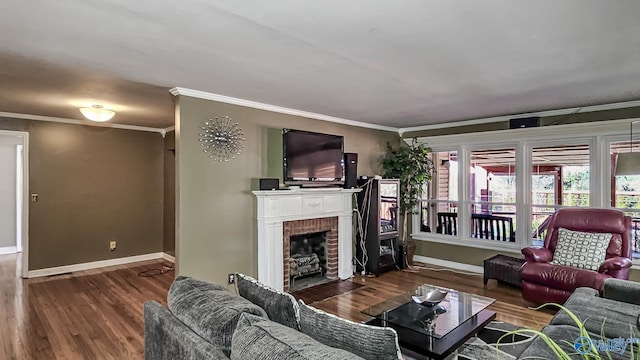 living room featuring dark hardwood / wood-style flooring, a brick fireplace, and ornamental molding