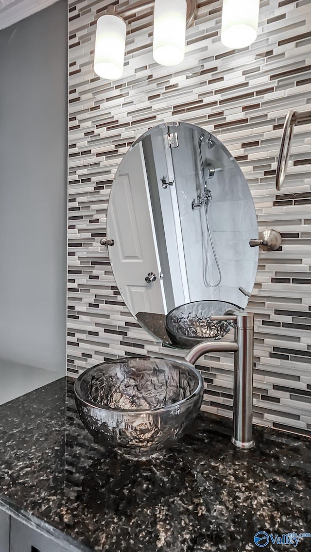 interior details featuring an outdoor fire pit and decorative backsplash