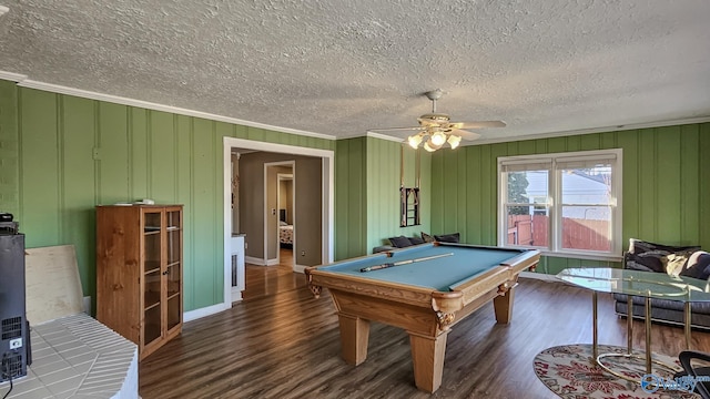 playroom with ceiling fan, billiards, ornamental molding, and dark hardwood / wood-style flooring