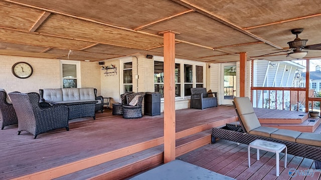 wooden deck featuring an outdoor hangout area and ceiling fan