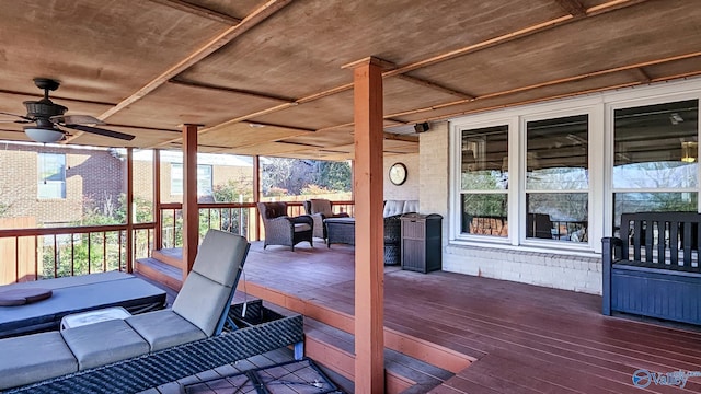 wooden terrace with outdoor lounge area and ceiling fan