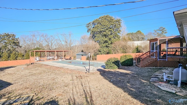 view of yard featuring a patio area and a covered pool