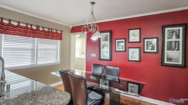 home office with hardwood / wood-style flooring and ornamental molding