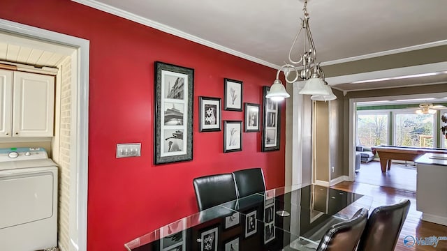 dining room with billiards, washer / clothes dryer, ornamental molding, and dark hardwood / wood-style floors