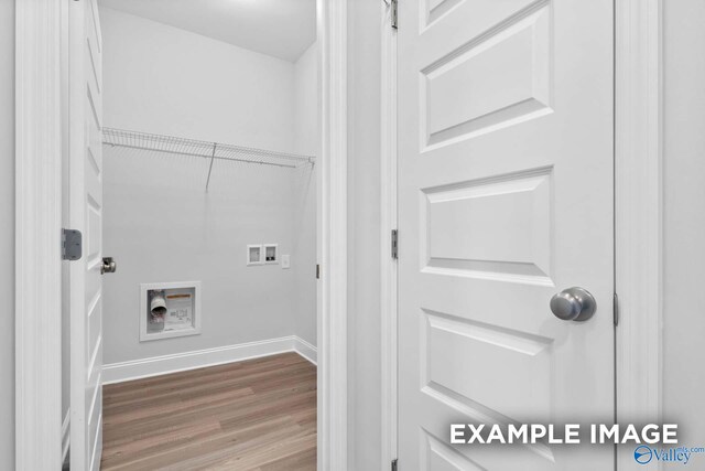 laundry area featuring wood-type flooring and hookup for a washing machine