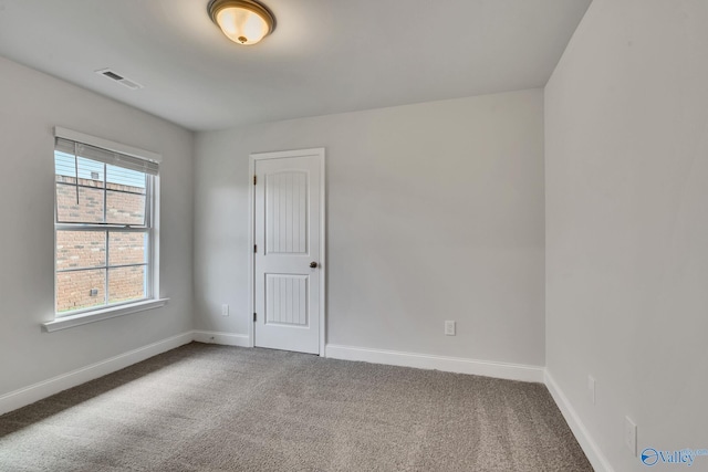 empty room with carpet flooring