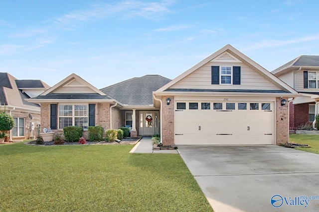 view of front of house featuring a garage and a front lawn