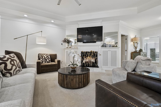 carpeted living room with recessed lighting, crown molding, ceiling fan, and a premium fireplace