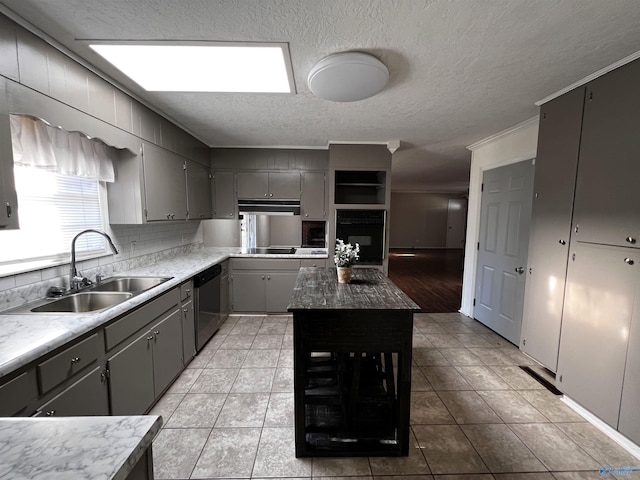 kitchen featuring light tile patterned flooring, gray cabinets, ornamental molding, a sink, and black appliances