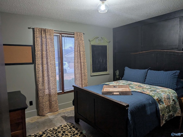 bedroom with a textured ceiling and carpet floors