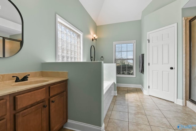 full bath with tile patterned flooring, baseboards, lofted ceiling, a bath, and vanity