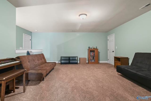 carpeted living room with baseboards and visible vents