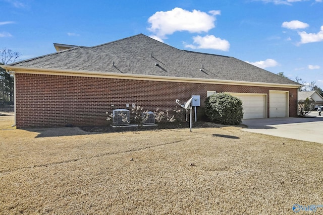 view of home's exterior with driveway, brick siding, roof with shingles, and an attached garage