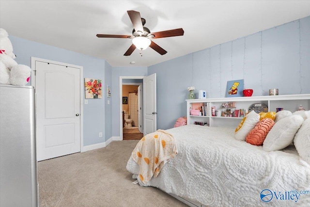 carpeted bedroom featuring baseboards and ceiling fan