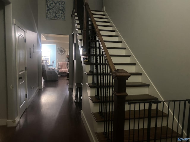 stairway featuring wood finished floors