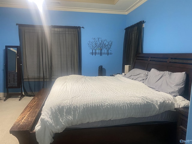 bedroom with carpet floors and ornamental molding
