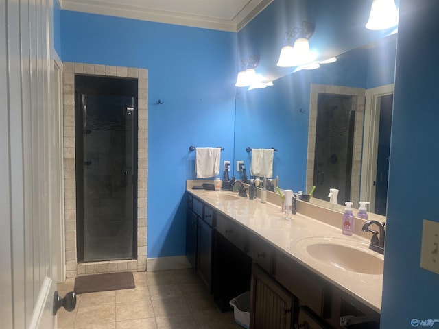 bathroom featuring a sink, a stall shower, and tile patterned flooring