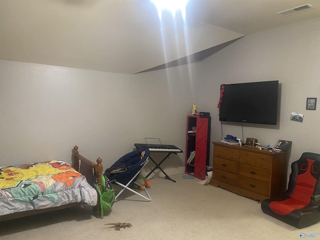 carpeted bedroom with vaulted ceiling and visible vents