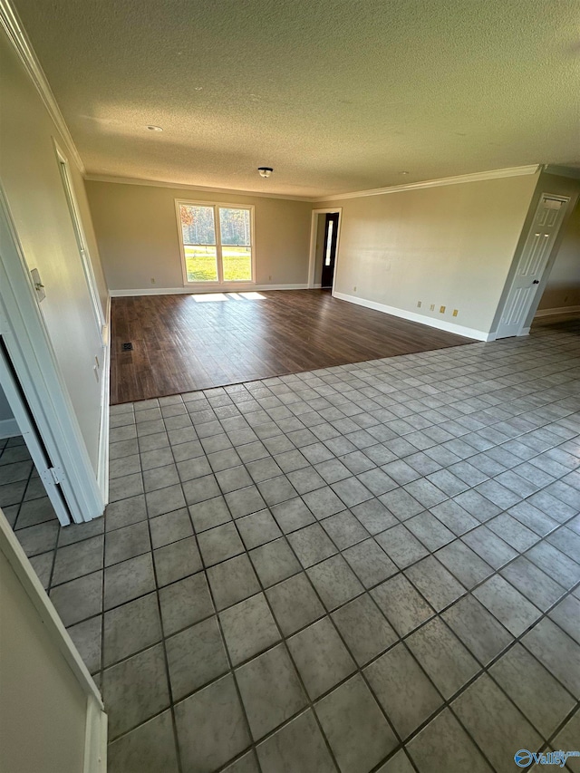 interior space featuring hardwood / wood-style floors, crown molding, and a textured ceiling