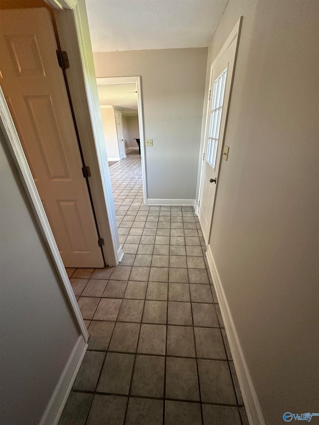 corridor featuring light tile patterned floors