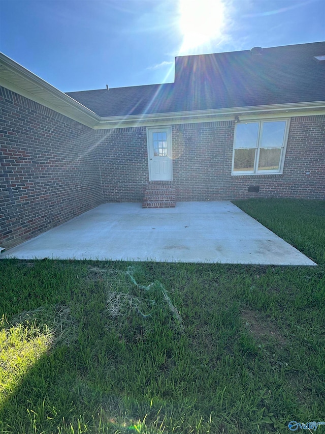 exterior space featuring a lawn and a patio