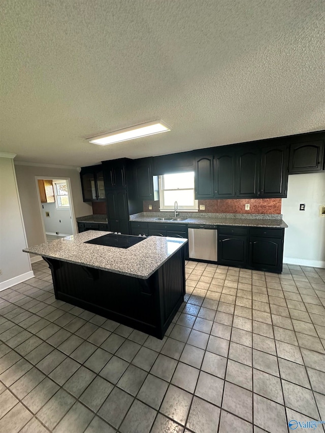 kitchen featuring black electric cooktop, a center island, stainless steel dishwasher, and sink