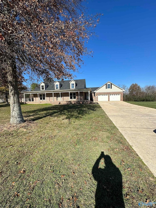 view of front of house with a garage and a front lawn